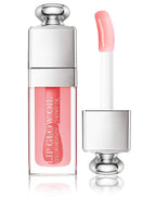 Christian Dior Dior Addict Lip Glow Oil in pink shade with glossy finish, 0.2 fl oz bottle featuring cherry oil for nourishing lip care.