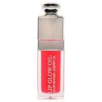 Christian Dior Dior Addict Lip Glow Oil in cherry pink shade with glossy finish, 0.2 fl oz bottle for nourishing lip care and shine.