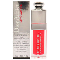 Christian Dior Dior Addict Lip Glow Oil 0.2 fl oz in shade 015, cherry oil-infused lip gloss with glossy finish for nourishing color-enhancement.