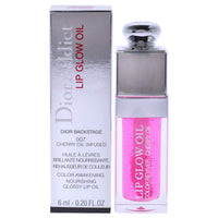 Christian Dior Dior Addict Lip Glow Oil 0.2 fl oz in shade 007 with cherry oil, shown in sleek packaging with glossy pink tint for radiant lips.